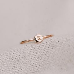 Our dainty initial round disc ring is a meaningful keepsake perfect for everyday wear. Whether it's a adding personal touch or a reminder of a special person/moment, this initial ring also stacks beautifully with our range of other dainty rings. 1 Typewriter Uppercase initial or symbol, hand stamped on our X-TINY disc (approximately 4.5mm in diameter) For symbols - please look at our X-TINY symbols chart in the photos to see what symbols we can stamp Available in sizes 2 US to 15 US Need help with sizing? Look at our size guide or purchase our ring sizer Due to its handmade nature, there may be some colour variances where the solder seam is Each Stamp + Shine piece is made from scratch in our little studio in Melbourne, Australia. The process begins with a clean metal sheet/ wire, which is Dainty 14k Gold Stamped Initial Ring, Dainty Tiny Initial Ring For Gift, Dainty Initials Ring Gift, Minimalist Hand Stamped Silver Initial Ring, Dainty Round Disc Jewelry With Initials, Rectangle Necklace, Crescent Necklace, Oval Necklace, How To Clean Metal