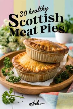 two small pies sitting on top of a wooden plate with the title overlay reads 30 healthy scottish meat pies