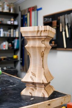 a wooden vase sitting on top of a table