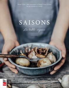 a person holding a bowl full of food with the title saisonss on it