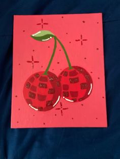 a card with two cherries on it