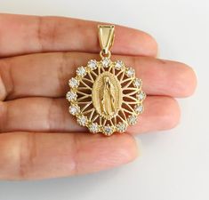 18k Gold Filled Guadalupe pendant with white CZ. Virgin Mary. Size: 38 x 25 mm Dije de la Virgen de Guadalupe en baño de Oro de 18k con zirconia cúbica blanca. Virgen Maria, Nuestra señora de Guadalupe. Tamaño: 38 x 25 mm Good Luck Bracelet, Evil Eye Pendant, Gold Filled, Etsy Gifts, Cubic Zirconia, 18k Gold, Handmade Items