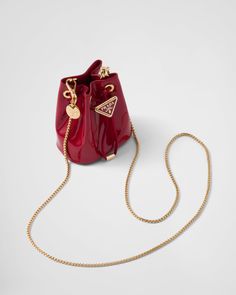 Find PRADA Patent Leather Mini-pouch on Editorialist. Drawstring closure Enameled metal triangle logo on closure Removable chain shoulder strap Leather interior Prada Mini, Luxury Bags Collection, Bag Prada, Red Purse, Mini Pouch, Girly Bags, Fancy Bags, Luxury Purses, Mini Pouches