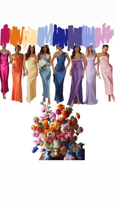 a group of women standing next to each other in different colored dresses and vases