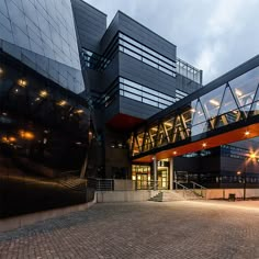 the entrance to an office building at dusk