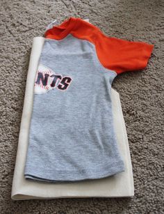 a baseball jersey laying on the floor