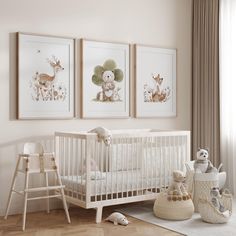 a baby's room with three framed pictures on the wall