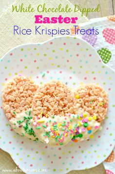 white chocolate dipped easter rice krispies treats in the shape of a heart on a plate