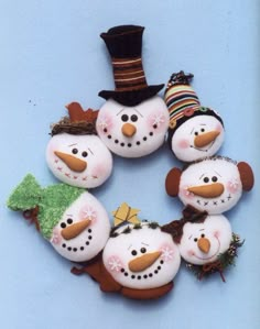 snowmen with hats and scarfs are arranged in a circle