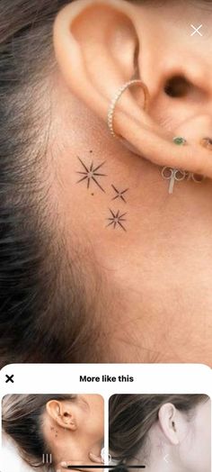 an ear piercing is shown with three stars on the top and bottom of the ear