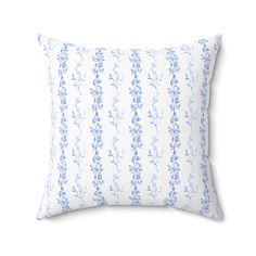 a blue and white pillow on a white background