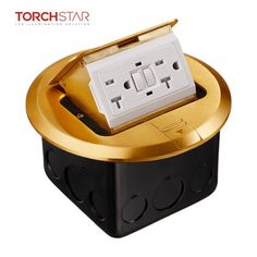 an image of a gold and black electrical outlet box with two outlets on each side