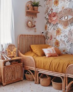 a bed room with a neatly made bed and wicker furniture next to a window