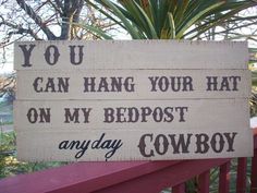 a sign that says you can hang your hat on my bedpost and pay cowboy