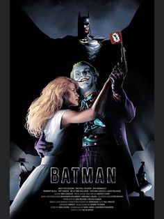 batman movie poster with the joker and catwoman holding up a bat in front of them