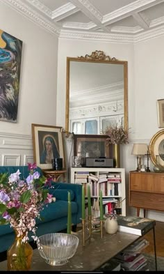 a living room filled with furniture and a large mirror