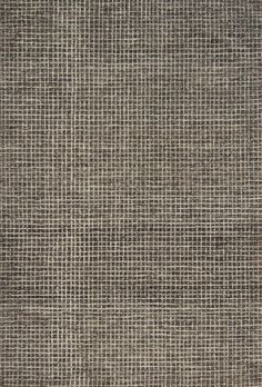 an area rug with grey squares on it