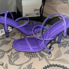 Never Worn Heels.Please See Pics Of Stained Areas On Heels.It Looks Like It Can Be Wiped Off Or Heels Can Be Cleaned. Size 40(Us9). Heel Height Looks Like A 3-3.5 Inch Purple Open Toe Heels With Sculpted Heel, Purple Heels With Sculpted Open Heel, Purple High Heel Sandals With Sculpted Heel, Purple Block Heel Shoes For Night Out, Purple Block Heel Heels For Night Out, Purple Pointed Toe Sandals For Night Out, Purple Sculpted Heel Summer Heels, Purple Ankle Strap Heels For Night Out, Purple Sculpted Heel Spring Heels