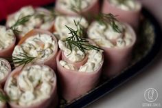 small rolls with cream cheese and dill on them