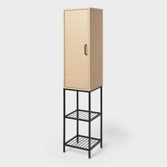 a tall wooden cabinet sitting on top of a metal shelf