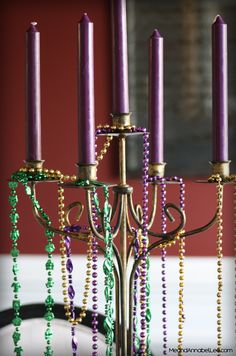 a candelabra with beads hanging from it's sides