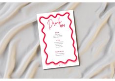 a pink and red drink up menu on top of a sheet of white paper with the words drink up