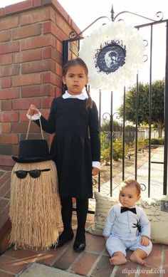 two young children dressed up in costumes