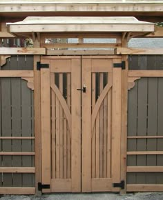 a wooden gate with two doors on each side