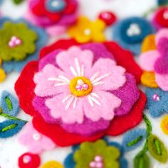 a close up of a flower on a table cloth