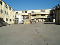 an empty parking lot in front of a building