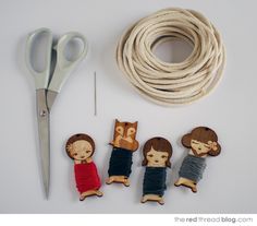 sewing supplies including yarn, scissors and small dolls