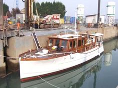 a small boat is docked at the dock