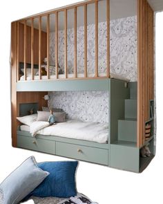 a bunk bed with stairs in the middle and pillows on the bottom floor below it