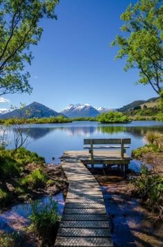 a wooden dock sitting next to a body of water