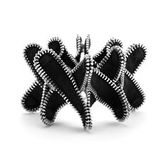 a black and white photo of an intricately designed ring with silver beads on it