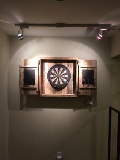 a dart board mounted to the side of a wall