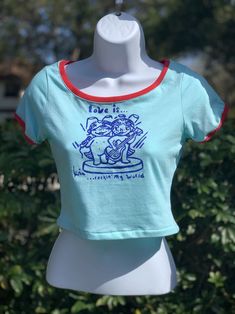 Retro Fitted Cotton Tops, Fitted Retro Cotton Tops, Fun Fitted Short Sleeve Tops, Fun Fitted Crew Neck Top, Blue Fitted Fun T-shirt, Spring Band Merch Fitted Tops, Unisex Fun Tops For Streetwear, Fun Fitted T-shirt With Screen Print, Fitted Blue Fun T-shirt