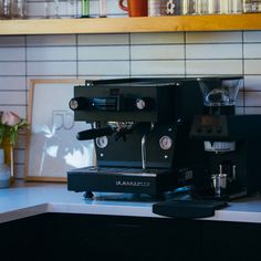 a coffee machine sitting on top of a counter