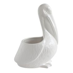 a white vase with a large bird on it's head in the shape of a beak