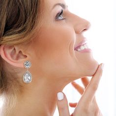 Add a touch of sparkle to your wardrobe with this versatile set of round and pear-shaped drop clip-on earrings. Featuring dazzling cubic zirconia stones set in elegant rhodium plating, these earrings offer a blend of classic and contemporary design. Their easy-to-wear clip-on style makes them perfect for any occasion, whether you're attending a business lunch or enjoying a glamorous evening out. A must-have accessory for anyone who appreciates a bit of sparkle and sophistication. Avoid contact w Business Lunch, August Birthstone Jewelry, July Birthstone Jewelry, Gifts For New Mums, Pearl Jewellery Earrings, Jewelry Ring Box, Velvet Pouch, Men's Jewelry Rings, August Birth Stone