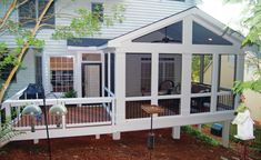 a house with a deck and screened porch