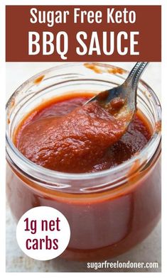 sugar free keto bbq sauce in a glass jar with a spoon sticking out