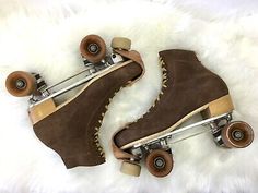 two skateboard boots with wheels on white fur