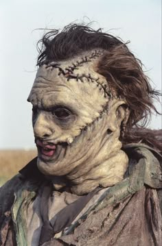 a man in zombie makeup with long hair