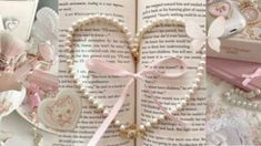 an open book with pink ribbon and heart decorations on the pages, surrounded by other items