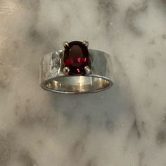 Size 6.5. Minimal Wear. Colorful And Bold, An Oval Faceted Garnet Set In 14k Gold Complements A Reflective Sterling Silver Hammered Band. Will Consider Reasonable Offers Questions? Leave A Comment Below. Modern Sterling Silver Ruby Ring For Anniversary, Modern Silver Ruby Ring With Oval Shape, Modern Silver Ruby Ring With Polished Finish, Modern Silver Ruby Ring For Formal Occasions, Modern Silver Ruby Rings, Modern Silver Rings With Ruby, James Avery Jewelry, Chunky Ring, Hammered Band