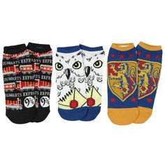 three pairs of socks with different designs on the front and back, one has an owl