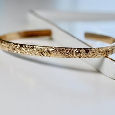 This thick gold filled floral open bangle is perfect for wearing alone or mixing and matching with your other cuffs.This open bangle was hand fabricated in Melt'm Jewelry Studio in CaliforniaNow we are offering engraving inside to our bracelets! DETAILS ABOUT THE BRACELET*** Gold filled floral bracelet is 5.2mm wide and 1.8mm thickness. Bracelet Flowers, Message Bracelet, Floral Bracelet, Topaz Jewelry, Tourmaline Jewelry, Open Bangle, Aquamarine Jewelry, Garnet Jewelry, Gold Cuffs