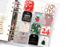 an open planner with christmas stickers on it