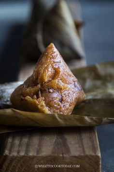 a pastry sitting on top of a wooden cutting board